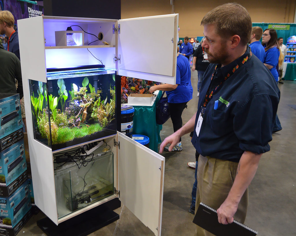 Aquarium Adventure's Dave Drake opens up the Kithros cabinetry to reveal the inner workings of the setup.