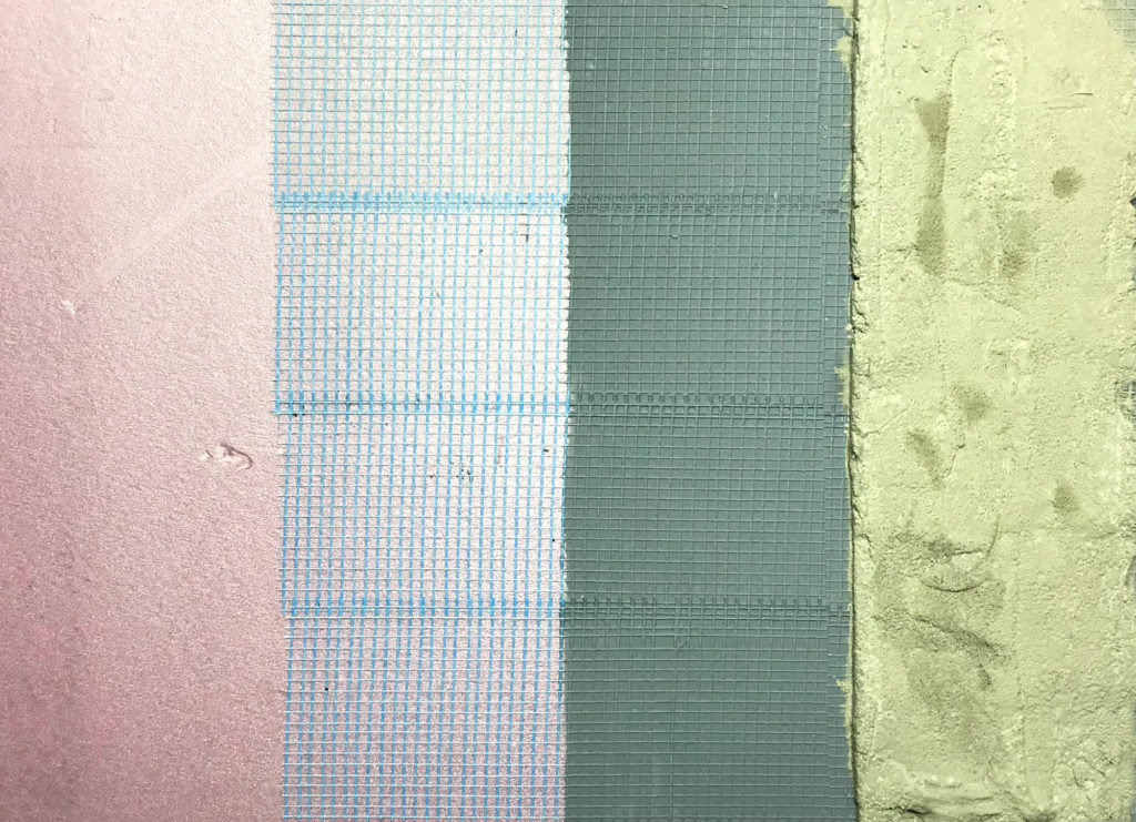 Basin construction layers, from left: pink extruded polystyrene foam, adhesive fiberglass tape, latex masonry waterproofer, surace bonding cement. 